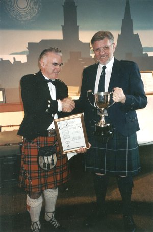 David C Purdie (right) receiving the Clement Wilson trophy from Sam Gilliland