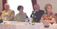 Kenneth Fee, Andree Ritchie, Dick Douglas and Margery Fee listening intently to Una