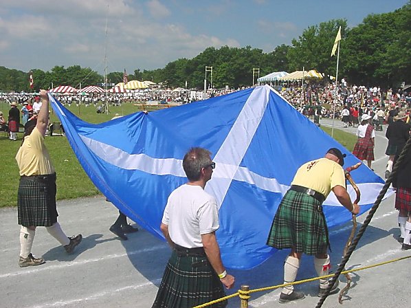 One of the clans lifted the Saltire of Scotland while walking in parade! A big flag, too! 