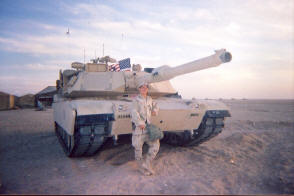 And Will standing in front of his tank in Iraq