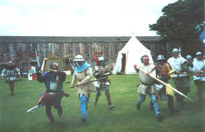 Re-enactors charge the crowd at Fort George